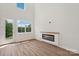 Bright living room with a fireplace and access to an outdoor balcony at 716 Flare Dr, Tega Cay, SC 29708