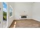Living room with a fireplace, large windows, and a walkout balcony at 716 Flare Dr, Tega Cay, SC 29708