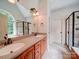 Spacious bathroom featuring a double sink vanity, framed mirrors, and a separate shower and tub at 8101 Cane Pointe Ln, Waxhaw, NC 28173