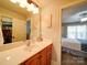 Cozy bathroom featuring ample counter space and a doorway with views into the primary bedroom at 8101 Cane Pointe Ln, Waxhaw, NC 28173