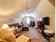 Spacious bonus room with a ceiling fan, plush sofa, workout equipment, and a large television, perfect for relaxation and fitness at 8101 Cane Pointe Ln, Waxhaw, NC 28173