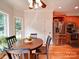 Breakfast Nook with wood table and chairs, lots of windows with a view to the back yard at 8101 Cane Pointe Ln, Waxhaw, NC 28173