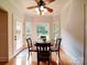 Breakfast nook with a wood table, lots of windows and access to the outdoor patio at 8101 Cane Pointe Ln, Waxhaw, NC 28173