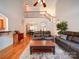 A living room with soaring ceilings, wood floors, leather couches and lots of natural light at 8101 Cane Pointe Ln, Waxhaw, NC 28173
