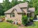 Aerial shot showcasing back of home, deck and access to yard. Air conditioning units are neatly tucked away behind bushes at 8101 Cane Pointe Ln, Waxhaw, NC 28173