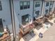 Aerial view of townhome featuring private balcony and exterior facade, with landscaping at 819 Anderson St, Charlotte, NC 28205