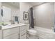 Clean bathroom with a white vanity, shower-tub combo, and modern fixtures at 819 Anderson St, Charlotte, NC 28205
