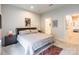 Cozy bedroom with ensuite bathroom featuring soft carpet and bright light fixture at 819 Anderson St, Charlotte, NC 28205