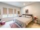 Bright bedroom featuring neutral walls, natural light, and minimalist decor at 819 Anderson St, Charlotte, NC 28205