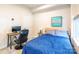 Well-lit bedroom featuring neutral walls, a sleek desk, and comfortable furnishings at 819 Anderson St, Charlotte, NC 28205