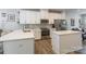 Modern kitchen with white cabinets, stainless steel appliances, and quartz countertops at 819 Anderson St, Charlotte, NC 28205
