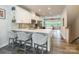 Bright and modern kitchen with quartz countertops, white cabinets, stainless appliances, and bar seating at 819 Anderson St, Charlotte, NC 28205