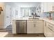 Spacious kitchen featuring white cabinetry, stainless steel appliances, and a large island at 819 Anderson St, Charlotte, NC 28205