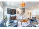 Bright and airy living room featuring stylish furniture, statement lighting, and large windows at 819 Anderson St, Charlotte, NC 28205