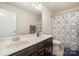 Charming bathroom with double sinks, and shower with decorative curtain at 9285 Swimming Dr, Harrisburg, NC 28075