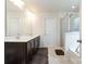 Elegant bathroom with double vanity, glass shower, soaking tub offering a spa-like experience at 9285 Swimming Dr, Harrisburg, NC 28075