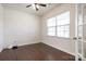 Cozy bedroom with hardwood floors and large windows, creating a warm and inviting space at 9285 Swimming Dr, Harrisburg, NC 28075