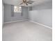 Basement featuring painted gray walls and carpeted floor; versatile space for any need at 9928 Raddington Ln, Charlotte, NC 28269