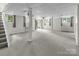 The basement space offers recessed ceiling lights and multiple windows for natural light at 9928 Raddington Ln, Charlotte, NC 28269