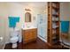 This bathroom offers a wooden vanity, shower, and shelving unit at 9928 Raddington Ln, Charlotte, NC 28269