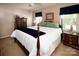 Comfortable bedroom with a four-poster bed, side tables, and lots of natural light at 9928 Raddington Ln, Charlotte, NC 28269