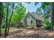 Charming exterior view of the well-maintained home with mature trees and landscaped yard at 9928 Raddington Ln, Charlotte, NC 28269