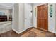 Elegant foyer with hardwood floors and a view into the living area at 9928 Raddington Ln, Charlotte, NC 28269