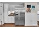 A kitchen with stainless steel refrigerator and white cabinetry at 9928 Raddington Ln, Charlotte, NC 28269