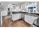 An open concept kitchen featuring stainless steel appliances and white cabinetry at 9928 Raddington Ln, Charlotte, NC 28269