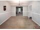 Spacious living room with neutral walls, carpet, and open access to other rooms at 9928 Raddington Ln, Charlotte, NC 28269