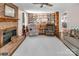 Comfortable living room with a brick fireplace, built-in shelving, and neutral decor at 9928 Raddington Ln, Charlotte, NC 28269