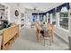 Cozy sun room featuring a dining table, lots of natural light, and access to the outdoors at 9928 Raddington Ln, Charlotte, NC 28269