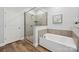 Modern bathroom featuring separate shower and soaking tub at 10022 Wayfair Meadow Ct, Charlotte, NC 28277