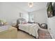Cozy bedroom featuring a comfortable bed, desk, and stylish decor for a welcoming atmosphere at 10022 Wayfair Meadow Ct, Charlotte, NC 28277