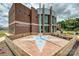 Exterior of the Cameron & Sara Morrison Gathering YMCA, with benches surrounding a star patterned brick courtyard at 10022 Wayfair Meadow Ct, Charlotte, NC 28277