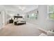 Spacious main bedroom with lots of natural light and neutral tones at 10022 Wayfair Meadow Ct, Charlotte, NC 28277