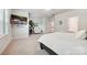 Upstairs main bedroom with TV, accent chair, and ensuite bath at 10022 Wayfair Meadow Ct, Charlotte, NC 28277