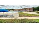 Exterior view showcasing the pool area, volleyball court, and the YMCA recreational facilities at 10022 Wayfair Meadow Ct, Charlotte, NC 28277