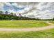 Large green sports field with soccer goals and cloudy skies, perfect for recreation and outdoor activities at 10022 Wayfair Meadow Ct, Charlotte, NC 28277