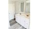 Bright bathroom with a double sink vanity, modern fixtures, and wood-look flooring at 1012 4Th St, Statesville, NC 28677
