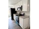 Modern kitchen featuring stainless steel appliances, white cabinets, and light countertops at 1012 4Th St, Statesville, NC 28677