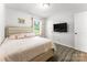 Cozy bedroom with a plush, light pink bedspread and luxury vinyl plank flooring at 106 Valley Rd, York, SC 29745