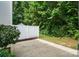 Backyard featuring a patio, privacy fence, and lush greenery, creating a serene outdoor oasis at 10867 Garden Oaks Ln, Charlotte, NC 28273