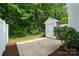 This backyard features a storage shed with a concrete patio space at 10867 Garden Oaks Ln, Charlotte, NC 28273