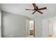 Bedroom with a ceiling fan shows the entrance to the bathroom and closet at 10867 Garden Oaks Ln, Charlotte, NC 28273