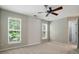 Bedroom with neutral walls and carpet showing two large windows at 10867 Garden Oaks Ln, Charlotte, NC 28273