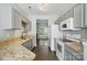 Spacious kitchen featuring granite counters, modern appliances, and tiled floor at 10867 Garden Oaks Ln, Charlotte, NC 28273