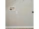 Neutral laundry room wall showing water hookups and electrical outlets at 10867 Garden Oaks Ln, Charlotte, NC 28273