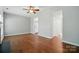View of the living room with hardwood floors showing the kitchen entrance at 10867 Garden Oaks Ln, Charlotte, NC 28273