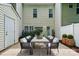 This patio has an outdoor dining space with a contemporary aesthetic at 10867 Garden Oaks Ln, Charlotte, NC 28273